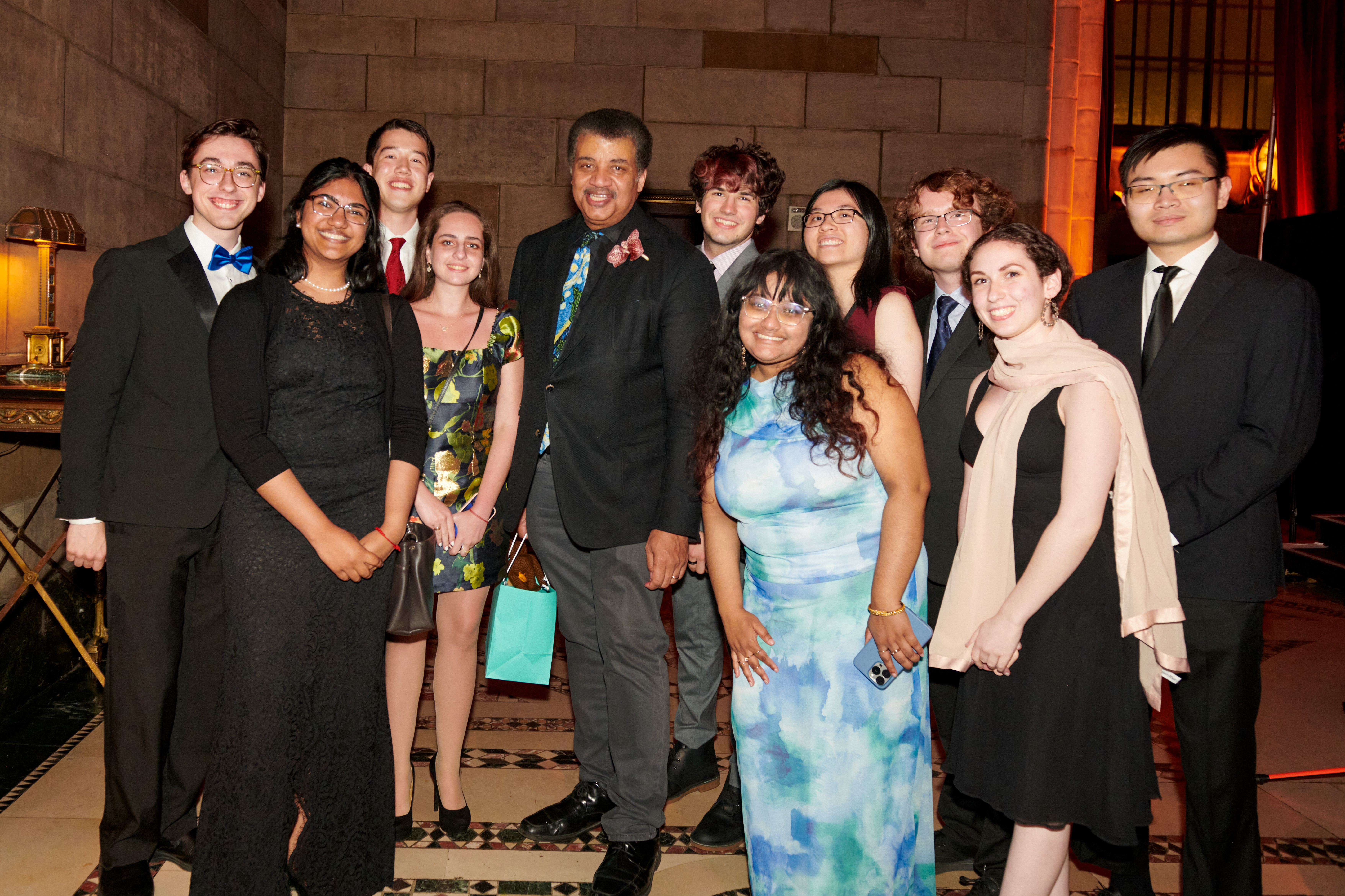 The current Stony Brook Trustee Scholars with Neil deGrasse Tyson. (Photo by Juliana Thomas)