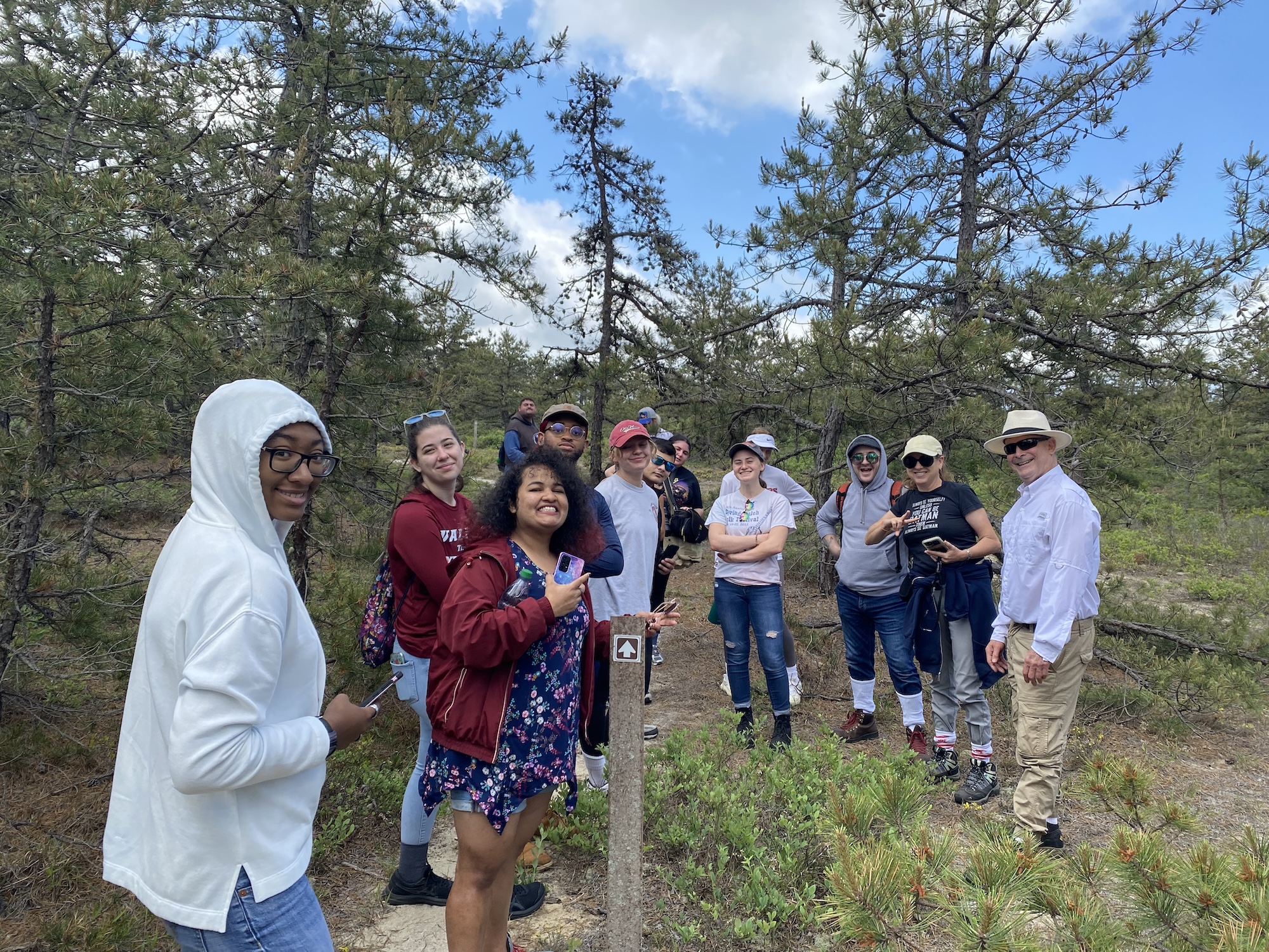 Student putting breathing mask on medical model