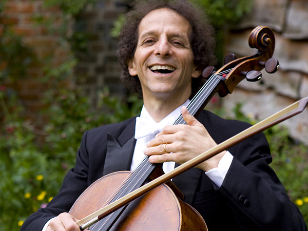 Colin Carr smiling and holding cello.